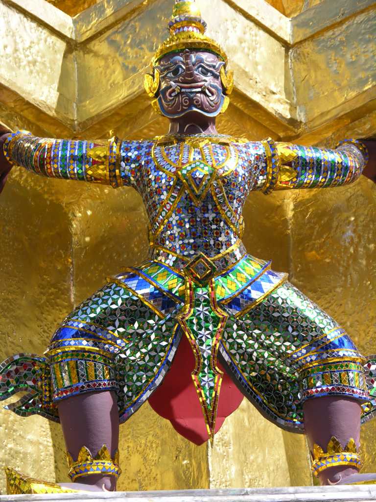 Bangkok 04 03 Wat Phra Kaeo Golden Phra Siratana Chedi Demon Here is the detail of one of the demons supporting the golden chedi at Bangkok�s Wat Phra Kaeo.